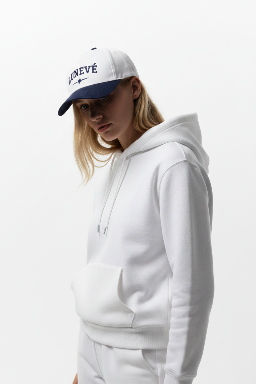 Female model – face obscured by brim